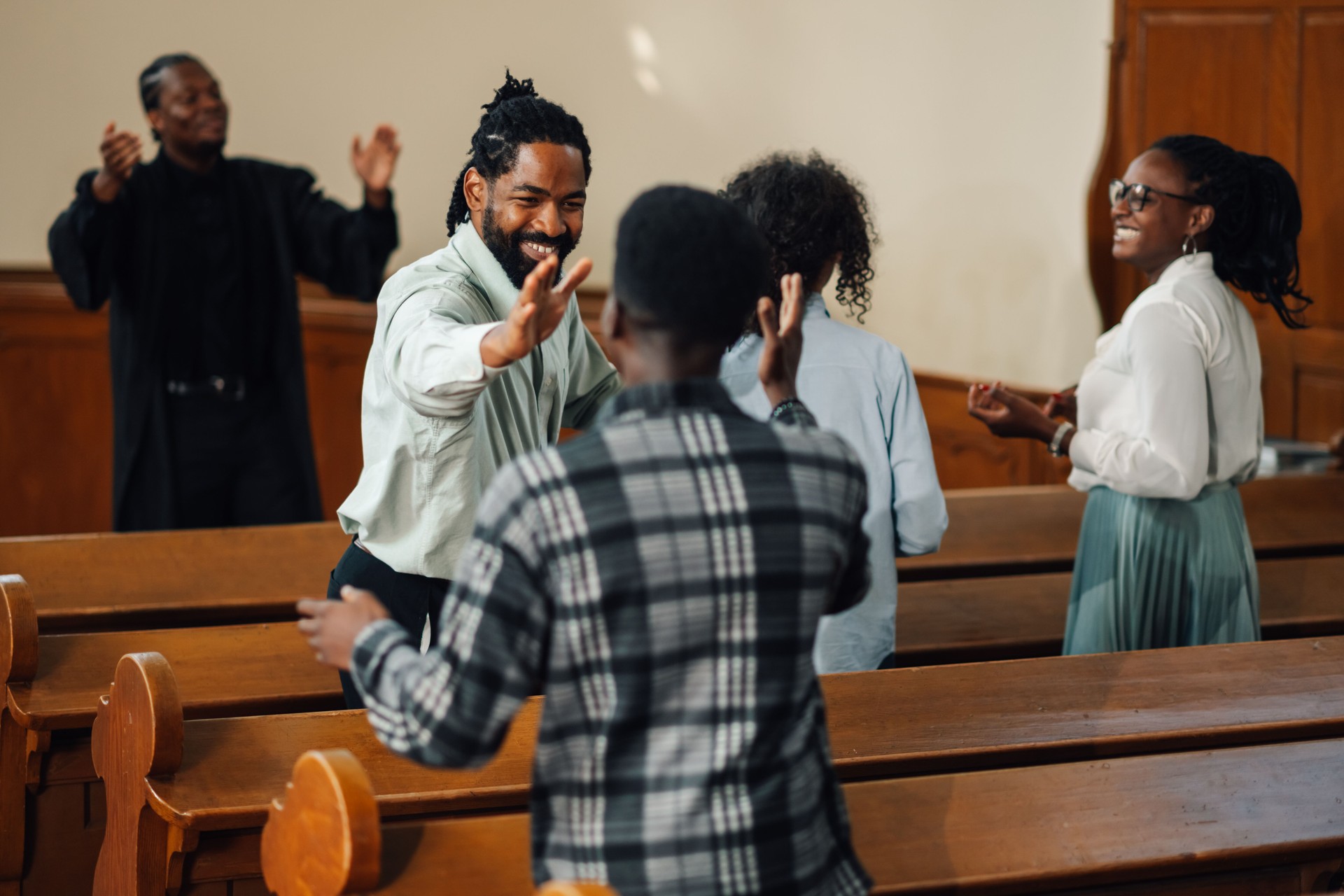 Group of people celebrating faith inside a church